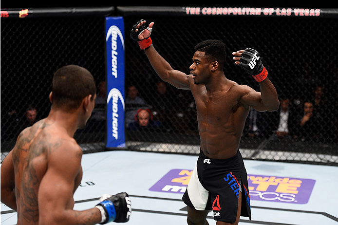 LAS VEGAS, NEVADA - DECEMBER 10: (R) Aljamain Sterling hypes up the crowd in his bantamweight bout against Johnny Eduardo during the UFC Fight Night event at The Chelsea at the Cosmopolitan of Las Vegas on December 10, 2015 in Las Vegas, Nevada. (Photo