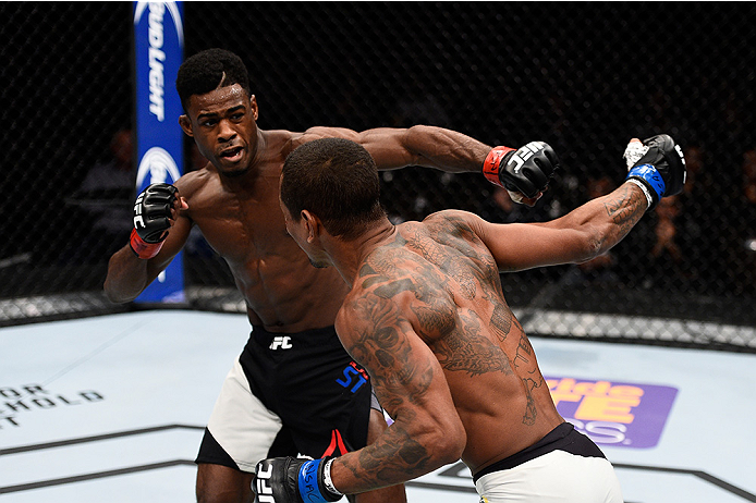 LAS VEGAS, NEVADA - DECEMBER 10: (R) Johnny Eduardo punches Aljamain Sterling in their bantamweight bout during the UFC Fight Night event at The Chelsea at the Cosmopolitan of Las Vegas on December 10, 2015 in Las Vegas, Nevada. (Photo by Jeff Bottari/Z