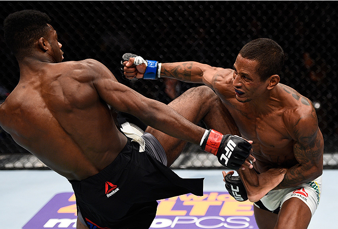 LAS VEGAS, NEVADA - DECEMBER 10: (R) Johnny Eduardo punches Aljamain Sterling in their bantamweight bout during the UFC Fight Night event at The Chelsea at the Cosmopolitan of Las Vegas on December 10, 2015 in Las Vegas, Nevada. (Photo by Jeff Bottari/Z