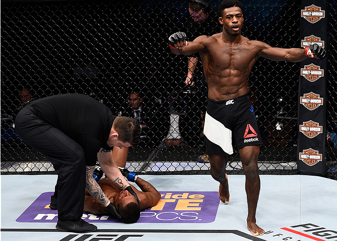LAS VEGAS, NEVADA - DECEMBER 10: (R) Aljamain Sterling celebrates his win over Johnny Eduardo in their bantamweight bout during the UFC Fight Night event at The Chelsea at the Cosmopolitan of Las Vegas on December 10, 2015 in Las Vegas, Nevada. (Photo b