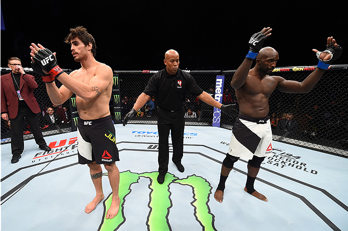 LAS VEGAS, NEVADA - DECEMBER 10: (L) Antonio Carlos Junior and Kevin Casey react to the no contest decision after an accidental eye poke in their middleweight bout during the UFC Fight Night event at The Chelsea at the Cosmopolitan of Las Vegas on Decemb