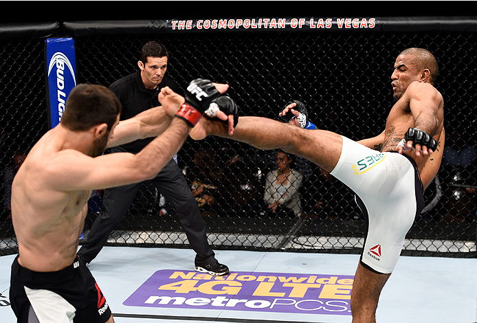 LAS VEGAS, NEVADA - DECEMBER 10: (R) Sergio Moraes kicks Omari Akhmedov in their welterweight bout during the UFC Fight Night event at The Chelsea at the Cosmopolitan of Las Vegas on December 10, 2015 in Las Vegas, Nevada. (Photo by Jeff Bottari/Zuffa L