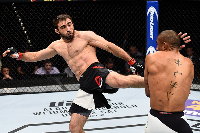 LAS VEGAS, NEVADA - DECEMBER 10: (L) Omari Akhmedov kicks Sergio Moraes in their welterweight bout during the UFC Fight Night event at The Chelsea at the Cosmopolitan of Las Vegas on December 10, 2015 in Las Vegas, Nevada. (Photo by Jeff Bottari/Zuffa L