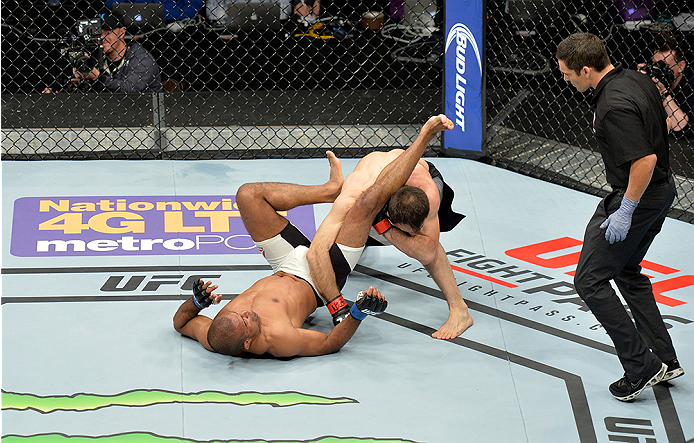 LAS VEGAS, NEVADA - DECEMBER 10: (Top) Omari Akhmedov punches Sergio Moraes in their welterweight bout during the UFC Fight Night event at The Chelsea at the Cosmopolitan of Las Vegas on December 10, 2015 in Las Vegas, Nevada. (Photo by Brandon Magnus/Z