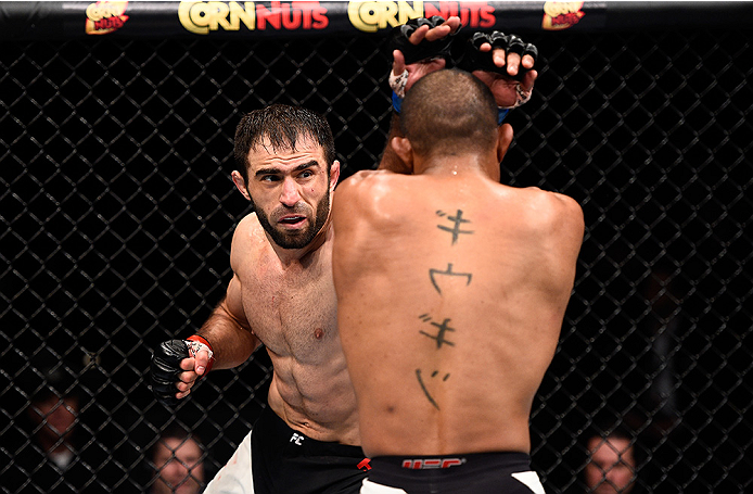LAS VEGAS, NEVADA - DECEMBER 10: (L) Omari Akhmedov punches Sergio Moraes in their welterweight bout during the UFC Fight Night event at The Chelsea at the Cosmopolitan of Las Vegas on December 10, 2015 in Las Vegas, Nevada. (Photo by Jeff Bottari/Zuffa