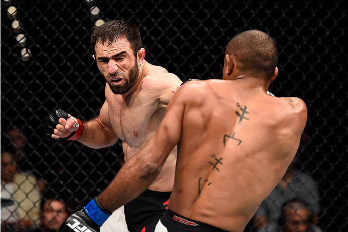 LAS VEGAS, NEVADA - DECEMBER 10: (L) Omari Akhmedov punches Sergio Moraes in their welterweight bout during the UFC Fight Night event at The Chelsea at the Cosmopolitan of Las Vegas on December 10, 2015 in Las Vegas, Nevada. (Photo by Jeff Bottari/Zuffa