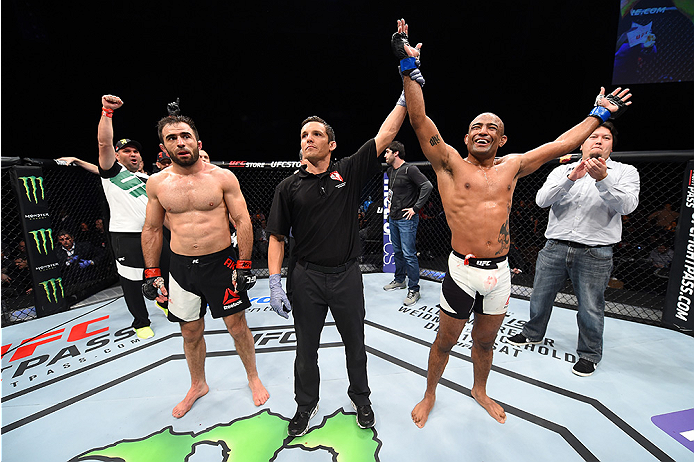 LAS VEGAS, NEVADA - DECEMBER 10: (R) Sergio Moraes celebrates his win over Omari Akhmedov in their welterweight bout during the UFC Fight Night event at The Chelsea at the Cosmopolitan of Las Vegas on December 10, 2015 in Las Vegas, Nevada. (Photo by Je