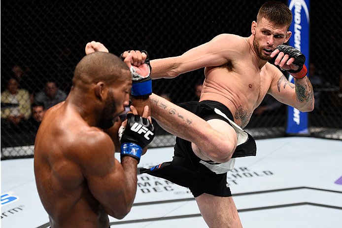 LAS VEGAS, NEVADA - DECEMBER 10: (R) Tim Means kicks John Howard in their welterweight bout during the UFC Fight Night event at The Chelsea at the Cosmopolitan of Las Vegas on December 10, 2015 in Las Vegas, Nevada. (Photo by Jeff Bottari/Zuffa LLC/Zuff