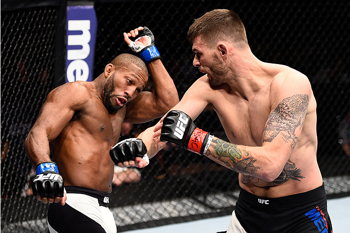 LAS VEGAS, NEVADA - DECEMBER 10: (R) Tim Means punches John Howard in their welterweight bout during the UFC Fight Night event at The Chelsea at the Cosmopolitan of Las Vegas on December 10, 2015 in Las Vegas, Nevada. (Photo by Jeff Bottari/Zuffa LLC/Zu