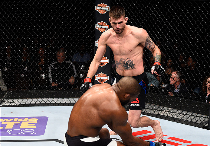 LAS VEGAS, NEVADA - DECEMBER 10: (Top) Tim Means knocks out John Howard in their welterweight bout during the UFC Fight Night event at The Chelsea at the Cosmopolitan of Las Vegas on December 10, 2015 in Las Vegas, Nevada. (Photo by Jeff Bottari/Zuffa L