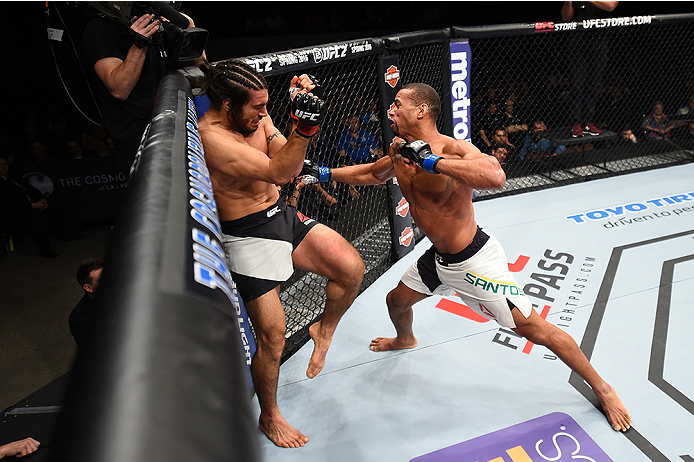LAS VEGAS, NEVADA - DECEMBER 10: (R) Thiago Santos punches Elias Theodorou in their middleweight bout during the UFC Fight Night event at The Chelsea at the Cosmopolitan of Las Vegas on December 10, 2015 in Las Vegas, Nevada. (Photo by Jeff Bottari/Zuff