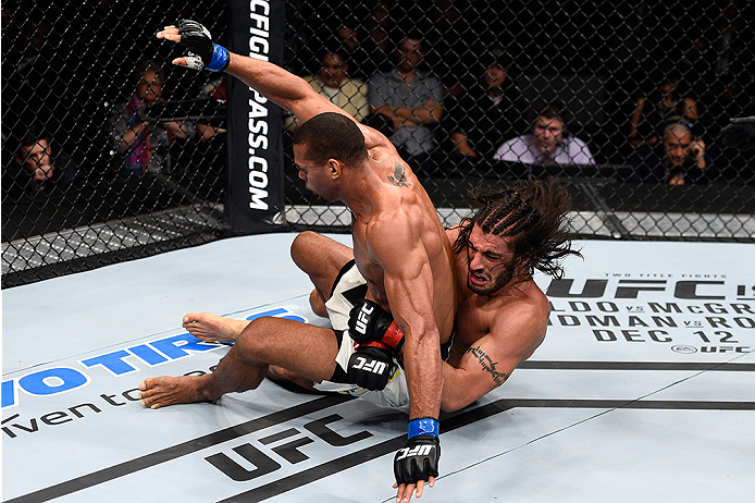 LAS VEGAS, NEVADA - DECEMBER 10: (R) Elias Theodorou takes down Thiago Santos in their middleweight bout during the UFC Fight Night event at The Chelsea at the Cosmopolitan of Las Vegas on December 10, 2015 in Las Vegas, Nevada. (Photo by Jeff Bottari/Z
