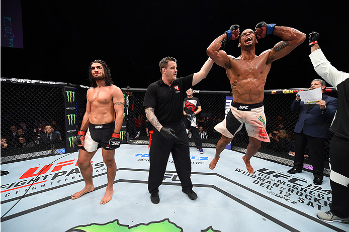 LAS VEGAS, NEVADA - DECEMBER 10: (R) Thiago Santos celebrates his win over Elias Theodorou in their middleweight bout during the UFC Fight Night event at The Chelsea at the Cosmopolitan of Las Vegas on December 10, 2015 in Las Vegas, Nevada. (Photo by J