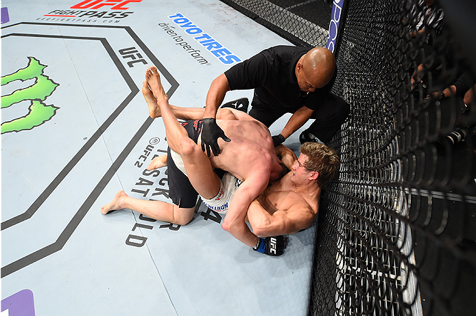LAS VEGAS, NEVADA - DECEMBER 10: (Bottom) Sage Northcutt wins by submission over Cody Pfister in their lightweight bout during the UFC Fight Night event at The Chelsea at the Cosmopolitan of Las Vegas on December 10, 2015 in Las Vegas, Nevada. (Photo by