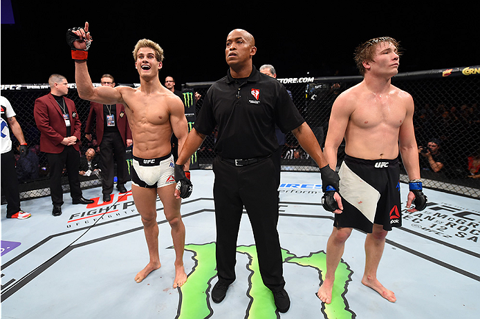 LAS VEGAS, NEVADA - DECEMBER 10: (L) Sage Northcutt celebrates his win over Cody Pfister in their lightweight bout during the UFC Fight Night event at The Chelsea at the Cosmopolitan of Las Vegas on December 10, 2015 in Las Vegas, Nevada. (Photo by Jeff