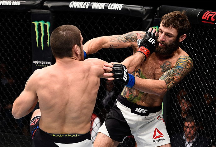 LAS VEGAS, NEVADA - DECEMBER 10: (L) Jim Miller exchanges punches with Michael Chiesa in their lightweight bout during the UFC Fight Night event at The Chelsea at the Cosmopolitan of Las Vegas on December 10, 2015 in Las Vegas, Nevada. (Photo by Jeff Bo