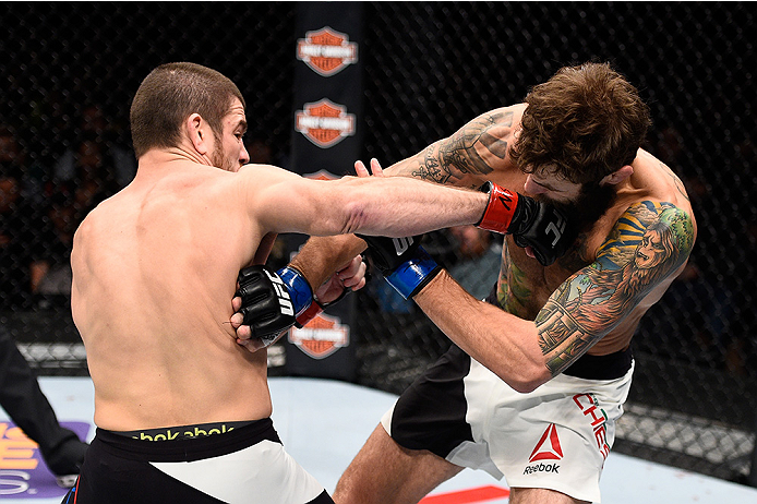 LAS VEGAS, NEVADA - DECEMBER 10: (L) Jim Miller punches Michael Chiesa in their lightweight bout during the UFC Fight Night event at The Chelsea at the Cosmopolitan of Las Vegas on December 10, 2015 in Las Vegas, Nevada. (Photo by Jeff Bottari/Zuffa LLC