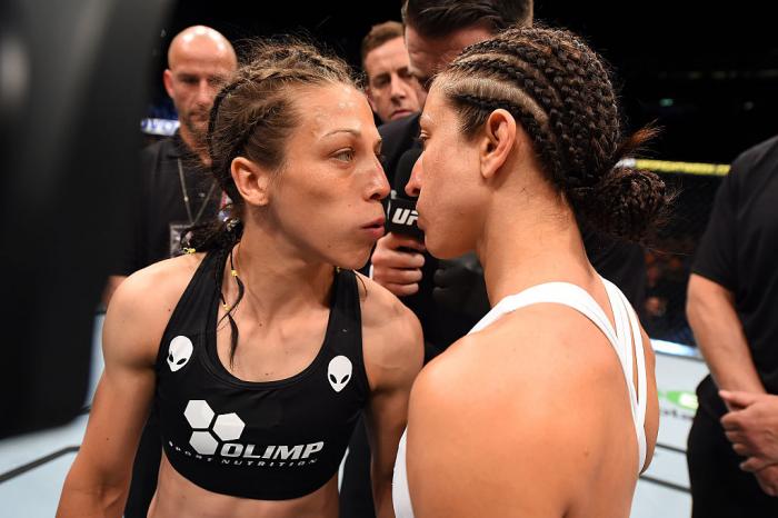Another classic Jedrzejczyk staredown, this time just before her first title defense against Jessica Penne. Joanna has said that her staredowns are not acting, but rather a chance to see the soul and the fear inside of her opponent. (Photo by Josh Hedges/