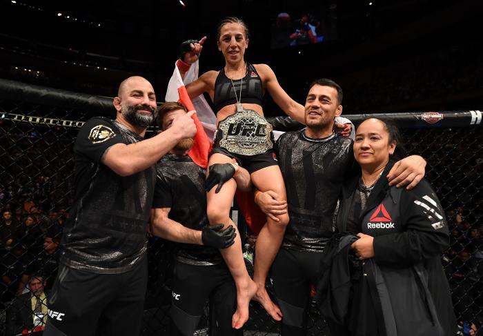 NEW YORK, NY - NOVEMBER 12: Joanna Jedrzejczyk of Poland celebrates her victory over Karolina Kowalkiewicz of Poland in their women's strawweight championship bout during the UFC 205 event at Madison Square Garden on November 12, 2016 in New York City.