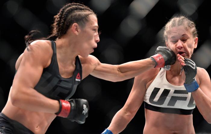NEW YORK, NY - NOVEMBER 12: (L-R) Joanna Jedrzejczyk of Poland punches Karolina Kowalkiewicz of Poland in their UFC women's strawweight championship fight during the UFC 205 event at Madison Square Garden on November 12, 2016 in New York City. (Photo by
