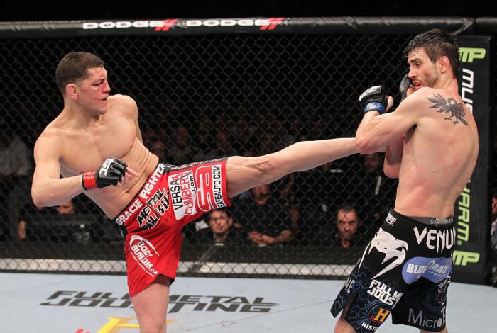 LAS VEGAS - FEBRUARY 04: (L-R) Nick Diaz kicks Carlos Condit during the UFC 143 event at Mandalay Bay Events Center on February 4, 2012 in Las Vegas, Nevada. (Photo by Nick Laham/Zuffa LLC/Zuffa LLC via Getty Images) *** Local Caption *** Nick Diaz; Car