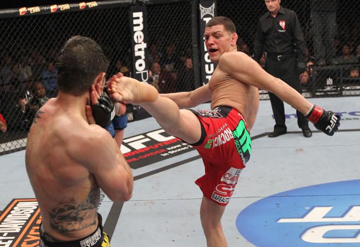 LAS VEGAS - FEBRUARY 04: (R-L) Nick Diaz kicks Carlos Condit during the UFC 143 event at Mandalay Bay Events Center on February 4, 2012 in Las Vegas, Nevada. (Photo by Nick Laham/Zuffa LLC/Zuffa LLC via Getty Images) *** Local Caption *** Nick Diaz; Car