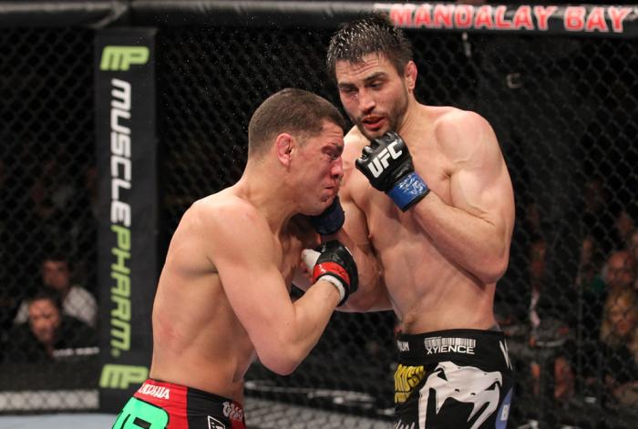 LAS VEGAS - FEBRUARY 04: Carlos Condit (right) punches Nick Diaz during the UFC 143 event at Mandalay Bay Events Center on February 4, 2012 in Las Vegas, Nevada. (Photo by Nick Laham/Zuffa LLC/Zuffa LLC via Getty Images) *** Local Caption *** Carlos Con