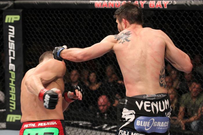 LAS VEGAS - FEBRUARY 04: Carlos Condit (right) punches Nick Diaz during the UFC 143 event at Mandalay Bay Events Center on February 4, 2012 in Las Vegas, Nevada. (Photo by Nick Laham/Zuffa LLC/Zuffa LLC via Getty Images) *** Local Caption *** Carlos Con