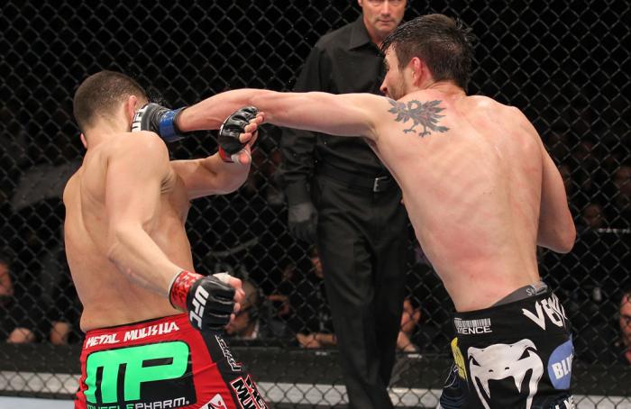 LAS VEGAS - FEBRUARY 04: Carlos Condit (right) punches Nick Diaz during the UFC 143 event at Mandalay Bay Events Center on February 4, 2012 in Las Vegas, Nevada. (Photo by Nick Laham/Zuffa LLC/Zuffa LLC via Getty Images) *** Local Caption *** Carlos Con