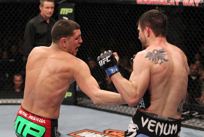 LAS VEGAS - FEBRUARY 04: Nick Diaz (left) punches Carlos Condit during the UFC 143 event at Mandalay Bay Events Center on February 4, 2012 in Las Vegas, Nevada. (Photo by Nick Laham/Zuffa LLC/Zuffa LLC via Getty Images) *** Local Caption *** Nick Diaz;