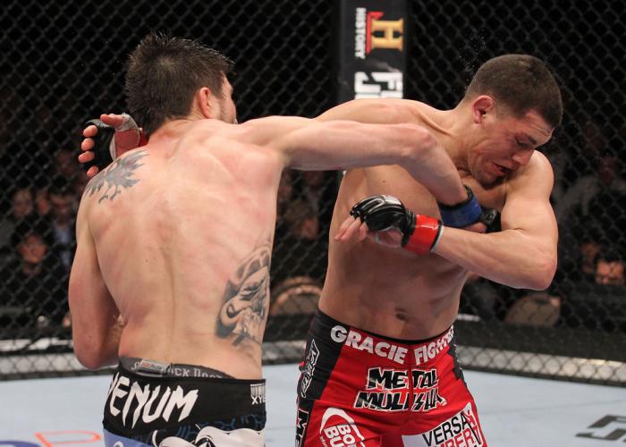 LAS VEGAS - FEBRUARY 04: Carlos Condit (left) punches Nick Diaz during the UFC 143 event at Mandalay Bay Events Center on February 4, 2012 in Las Vegas, Nevada. (Photo by Nick Laham/Zuffa LLC/Zuffa LLC via Getty Images) *** Local Caption *** Carlos Cond