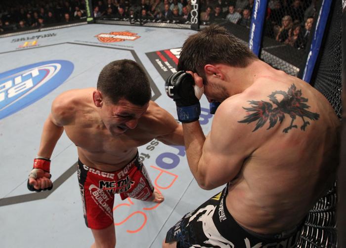 LAS VEGAS - FEBRUARY 04: Nick Diaz (left) punches Carlos Condit during the UFC 143 event at Mandalay Bay Events Center on February 4, 2012 in Las Vegas, Nevada. (Photo by Nick Laham/Zuffa LLC/Zuffa LLC via Getty Images) *** Local Caption *** Nick Diaz;