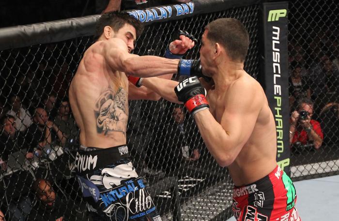 LAS VEGAS - FEBRUARY 04: (R-L) Nick Diaz punches Carlos Condit during the UFC 143 event at Mandalay Bay Events Center on February 4, 2012 in Las Vegas, Nevada. (Photo by Nick Laham/Zuffa LLC/Zuffa LLC via Getty Images) *** Local Caption *** Carlos Condi