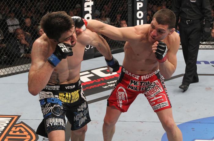 LAS VEGAS - FEBRUARY 04: (R-L) Nick Diaz punches Carlos Condit during the UFC 143 event at Mandalay Bay Events Center on February 4, 2012 in Las Vegas, Nevada. (Photo by Nick Laham/Zuffa LLC/Zuffa LLC via Getty Images) *** Local Caption *** Carlos Condi