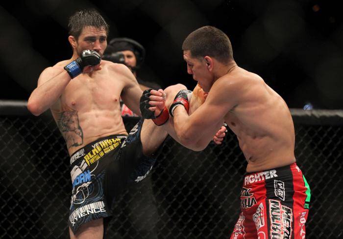 LAS VEGAS - FEBRUARY 04: Carlos Condit (left) kicks Nick Diaz during the UFC 143 event at Mandalay Bay Events Center on February 4, 2012 in Las Vegas, Nevada. (Photo by Josh Hedges/Zuffa LLC/Zuffa LLC via Getty Images) *** Local Caption *** Carlos Condi