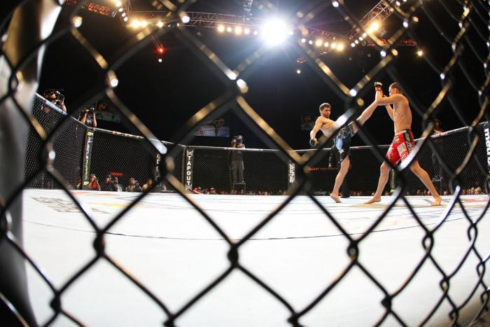 LAS VEGAS - FEBRUARY 04: Carlos Condit (left) kicks Nick Diaz during the UFC 143 event at Mandalay Bay Events Center on February 4, 2012 in Las Vegas, Nevada. (Photo by Nick Laham/Zuffa LLC/Zuffa LLC via Getty Images) *** Local Caption *** Carlos Condit