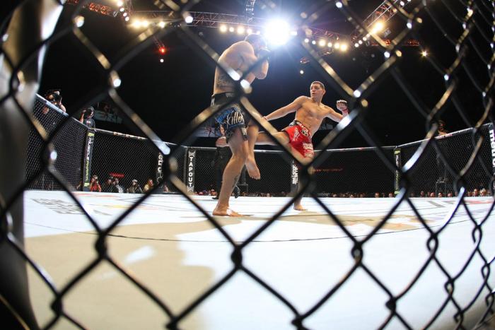 LAS VEGAS - FEBRUARY 04: (R-L) Nick Diaz kicks Carlos Condit during the UFC 143 event at Mandalay Bay Events Center on February 4, 2012 in Las Vegas, Nevada. (Photo by Nick Laham/Zuffa LLC/Zuffa LLC via Getty Images) *** Local Caption *** Nick Diaz; Car