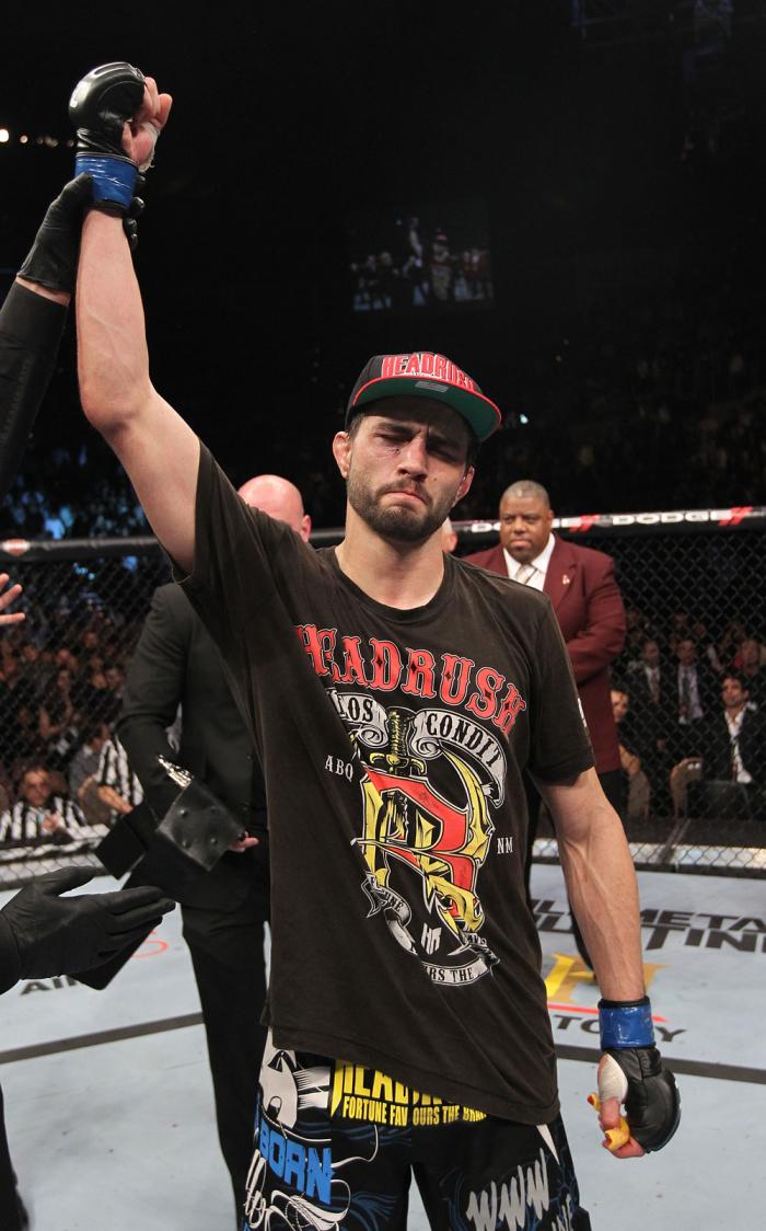 LAS VEGAS - FEBRUARY 04: Carlos Condit is declared the winner in his fight with Nick Diaz during the UFC 143 event at Mandalay Bay Events Center on February 4, 2012 in Las Vegas, Nevada. (Photo by Nick Laham/Zuffa LLC/Zuffa LLC via Getty Images) *** Loc