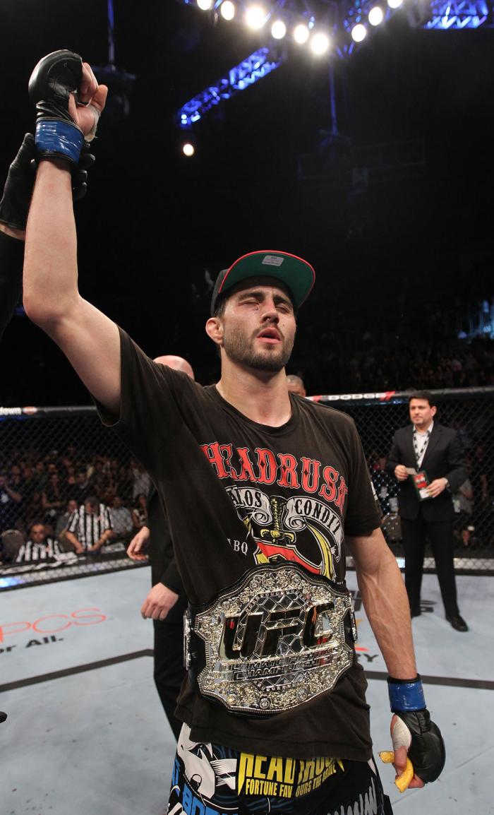LAS VEGAS - FEBRUARY 04: Carlos Condit receives the interim UFC welterweight championship belt after defeating Nick Diaz during the UFC 143 event at Mandalay Bay Events Center on February 4, 2012 in Las Vegas, Nevada. (Photo by Nick Laham/Zuffa LLC/Zuff