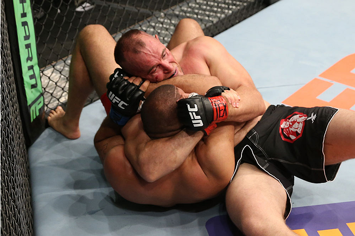 SAN ANTONIO, TX - JUNE 28: Oleksiy Oliynyk (right) attempts to submit Anthony Hamilton in their heavyweight bout at the AT&T Center on June 28, 2014 in San Antonio, Texas. (Photo by Ed Mulholland/Zuffa LLC/Zuffa LLC via Getty Images)