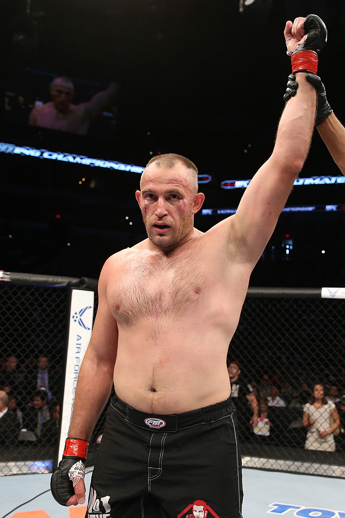 SAN ANTONIO, TX - JUNE 28: Oleksiy Oliynyk reacts to his victory over Anthony Hamilton in their heavyweight bout at the AT&T Center on June 28, 2014 in San Antonio, Texas. (Photo by Ed Mulholland/Zuffa LLC/Zuffa LLC via Getty Images)