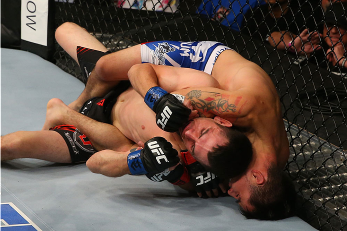 SAN ANTONIO, TX - JUNE 28: Ray Borg (top) attempts to submit Shane Howell in their flyweight bout at the AT&T Center on June 28, 2014 in San Antonio, Texas. (Photo by Ed Mulholland/Zuffa LLC/Zuffa LLC via Getty Images)