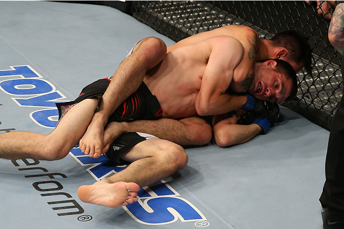 SAN ANTONIO, TX - JUNE 28: Ray Borg attempts to submit Shane Howell (black shorts) in their flyweight bout at the AT&T Center on June 28, 2014 in San Antonio, Texas. (Photo by Ed Mulholland/Zuffa LLC/Zuffa LLC via Getty Images)