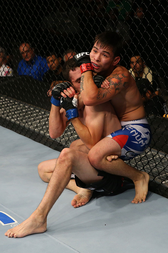 SAN ANTONIO, TX - JUNE 28: Ray Borg (right) attempts to submit Shane Howell in their flyweight bout at the AT&T Center on June 28, 2014 in San Antonio, Texas. (Photo by Ed Mulholland/Zuffa LLC/Zuffa LLC via Getty Images)