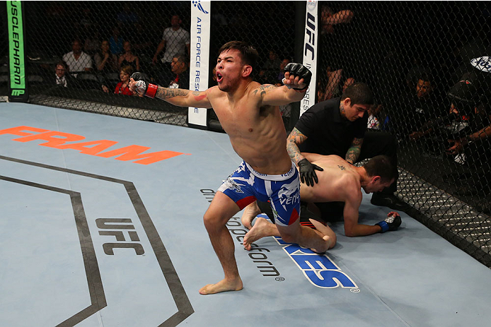 SAN ANTONIO, TX - JUNE 28: Ray Borg (blue shorts) reacts to his victory over Shane Howell in their flyweight bout at the AT&T Center on June 28, 2014 in San Antonio, Texas. (Photo by Ed Mulholland/Zuffa LLC/Zuffa LLC via Getty Images)