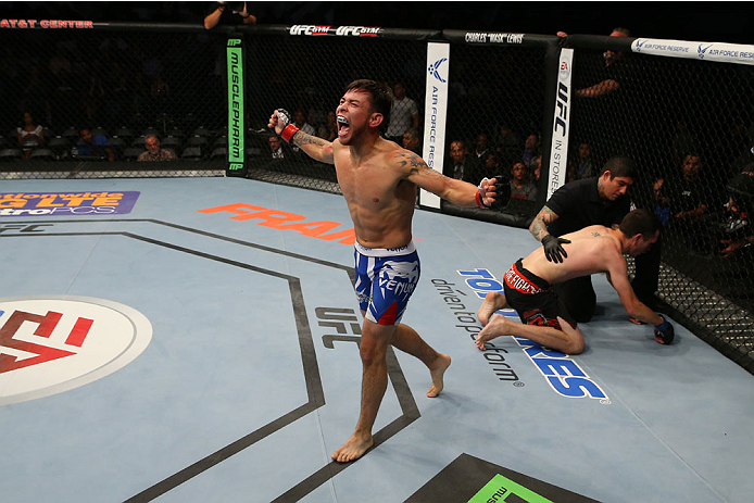 SAN ANTONIO, TX - JUNE 28: Ray Borg (blue shorts) reacts to his victory over Shane Howell in their flyweight bout at the AT&T Center on June 28, 2014 in San Antonio, Texas. (Photo by Ed Mulholland/Zuffa LLC/Zuffa LLC via Getty Images)