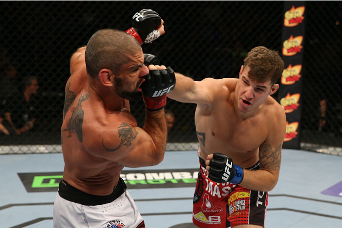 SAN ANTONIO, TX - JUNE 28: (R-L) Andy Enz punches Marcelo Guimaraes in their middleweight bout at the AT&T Center on June 28, 2014 in San Antonio, Texas. (Photo by Ed Mulholland/Zuffa LLC/Zuffa LLC via Getty Images)