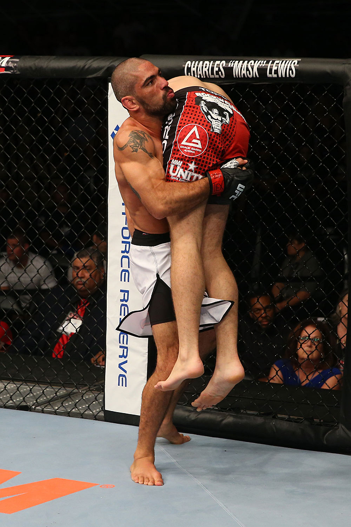SAN ANTONIO, TX - JUNE 28: Marcelo Guimaraes (white shorts carries Andy Enz in their middleweight bout at the AT&T Center on June 28, 2014 in San Antonio, Texas. (Photo by Ed Mulholland/Zuffa LLC/Zuffa LLC via Getty Images)