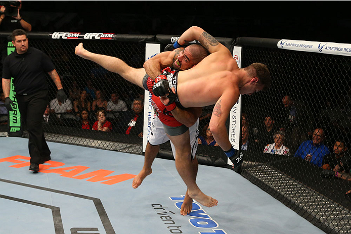 SAN ANTONIO, TX - JUNE 28: Marcelo Guimaraes (white shorts) slams Andy Enz in their middleweight bout at the AT&T Center on June 28, 2014 in San Antonio, Texas. (Photo by Ed Mulholland/Zuffa LLC/Zuffa LLC via Getty Images)