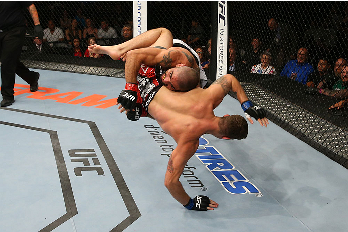 SAN ANTONIO, TX - JUNE 28: Marcelo Guimaraes (top) slams Andy Enz in their middleweight bout at the AT&T Center on June 28, 2014 in San Antonio, Texas. (Photo by Ed Mulholland/Zuffa LLC/Zuffa LLC via Getty Images)